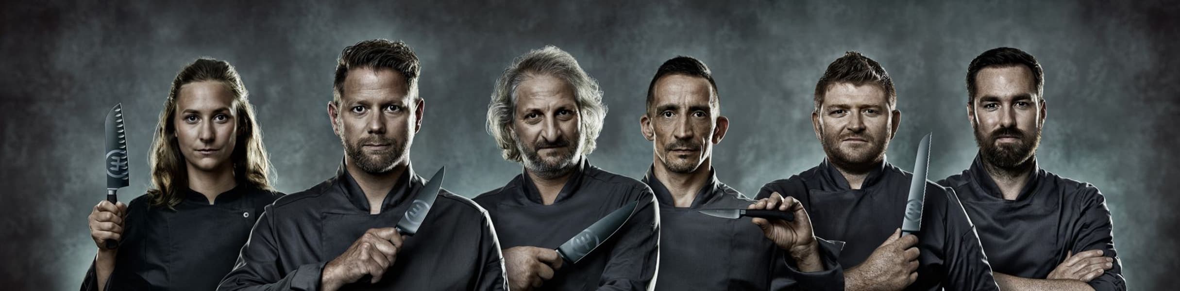 Image of 6 chefs in a line holding performer blades