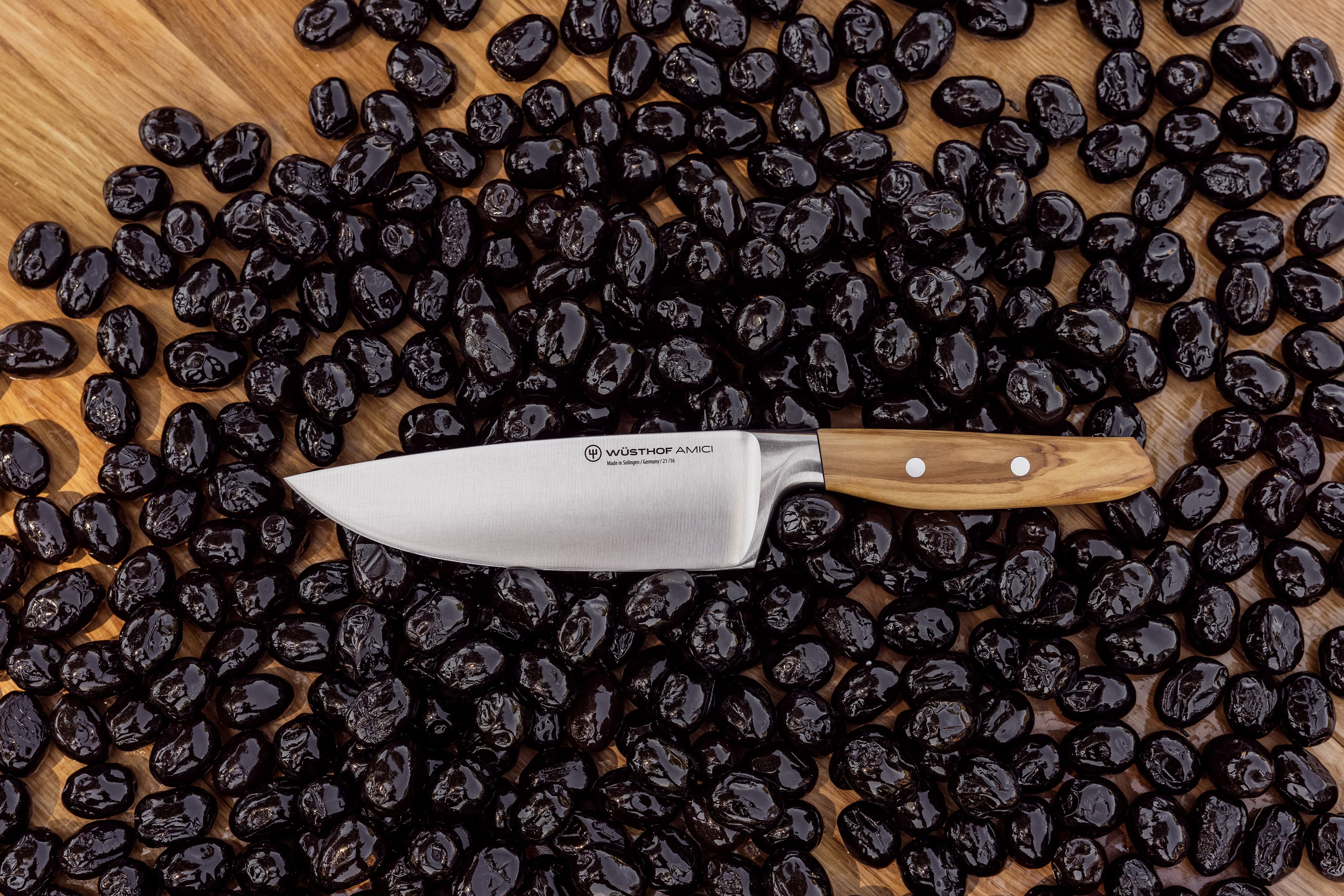 amici knife on top of capers