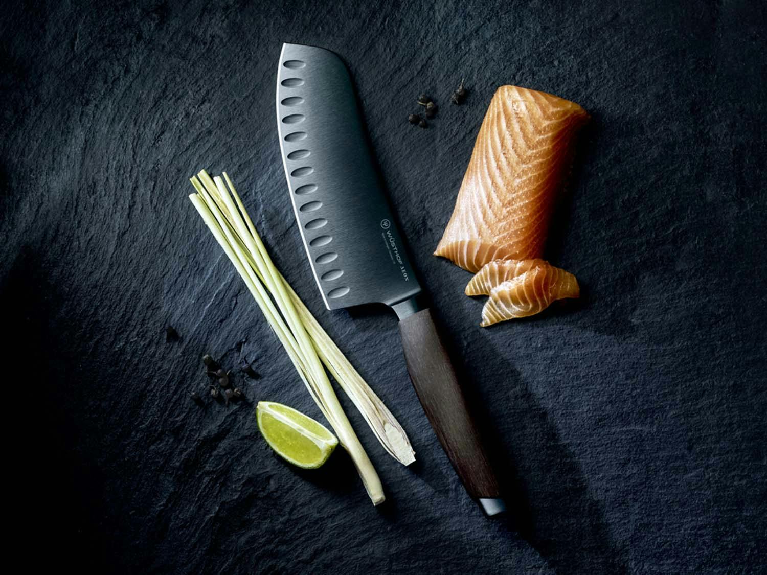 Aeon Santoku knife next to a piece of salmon